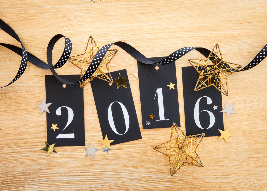 2016 written on gift tags with glittery christmas decoration
