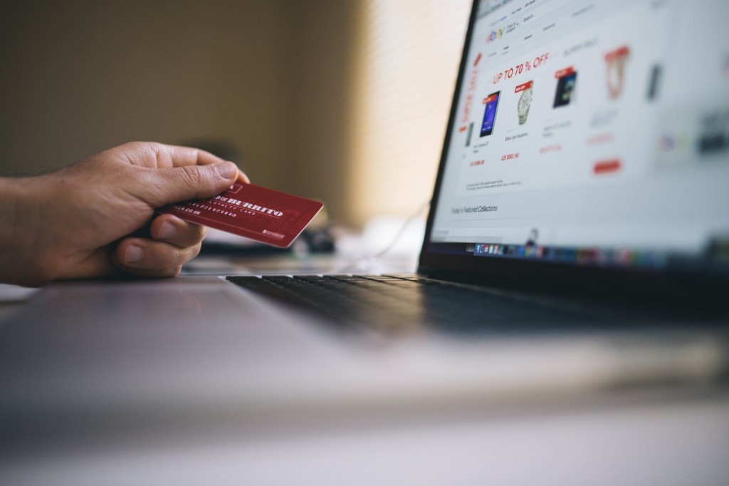 Man using credit card on financial websites