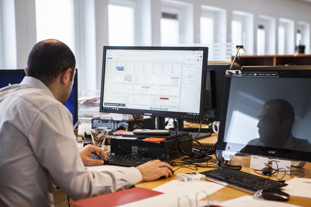 Man at his desk making financial website security preparations