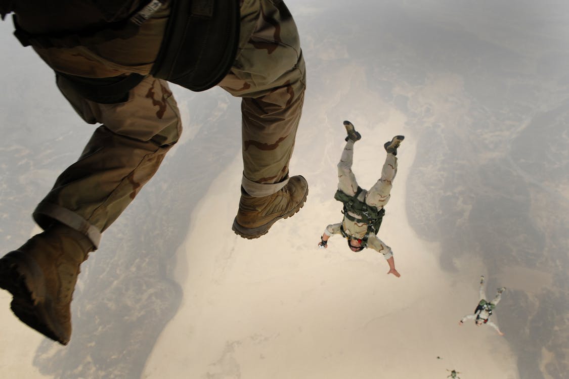 soldiers jumping out of a plane, illustrating a nosedive in financial marketing!