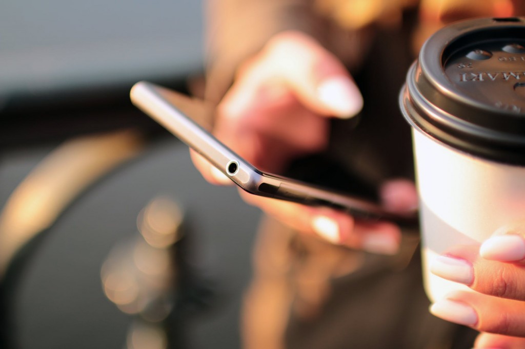 Email being read on a mobile phone, showing the importance of mobile first in financial marketing