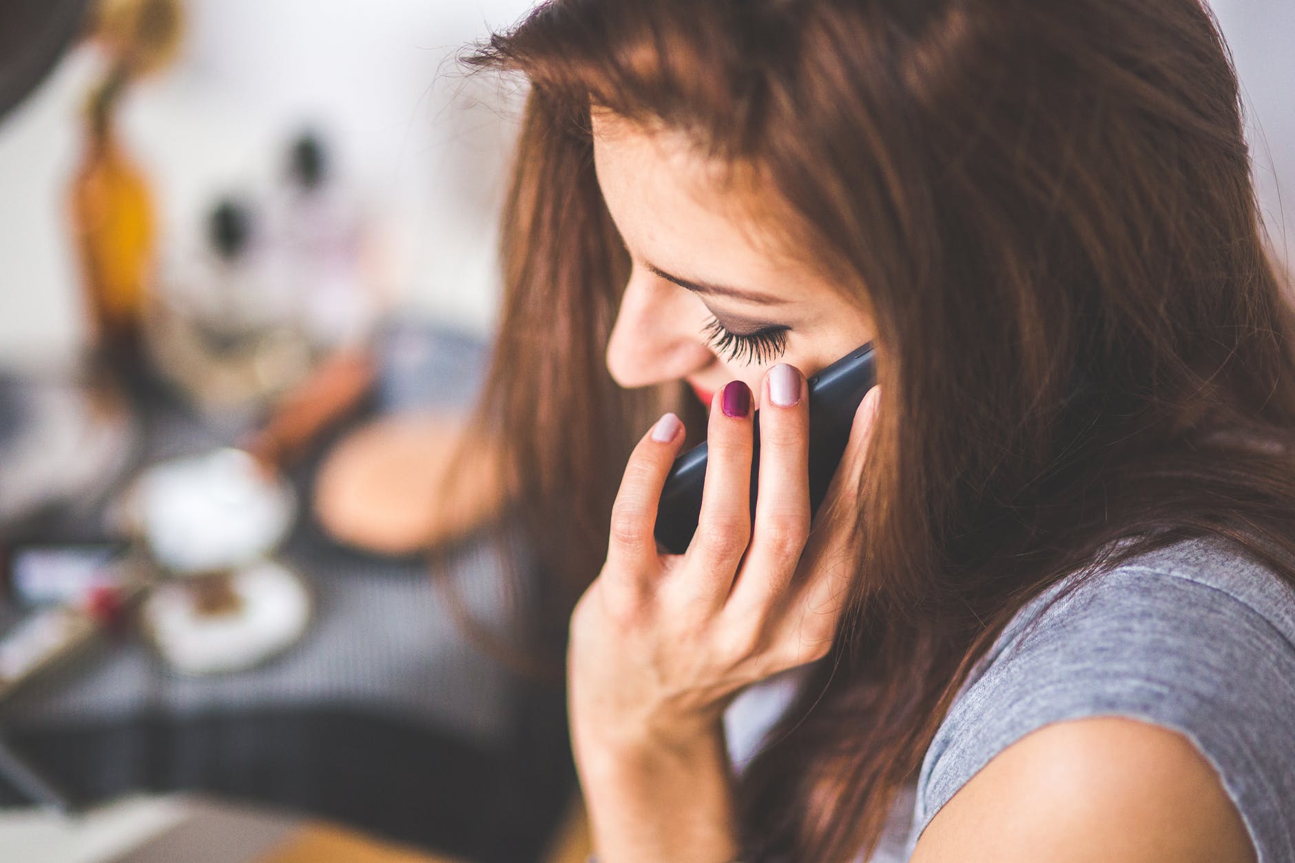 Women using voice search on her phone to trawl financial websites