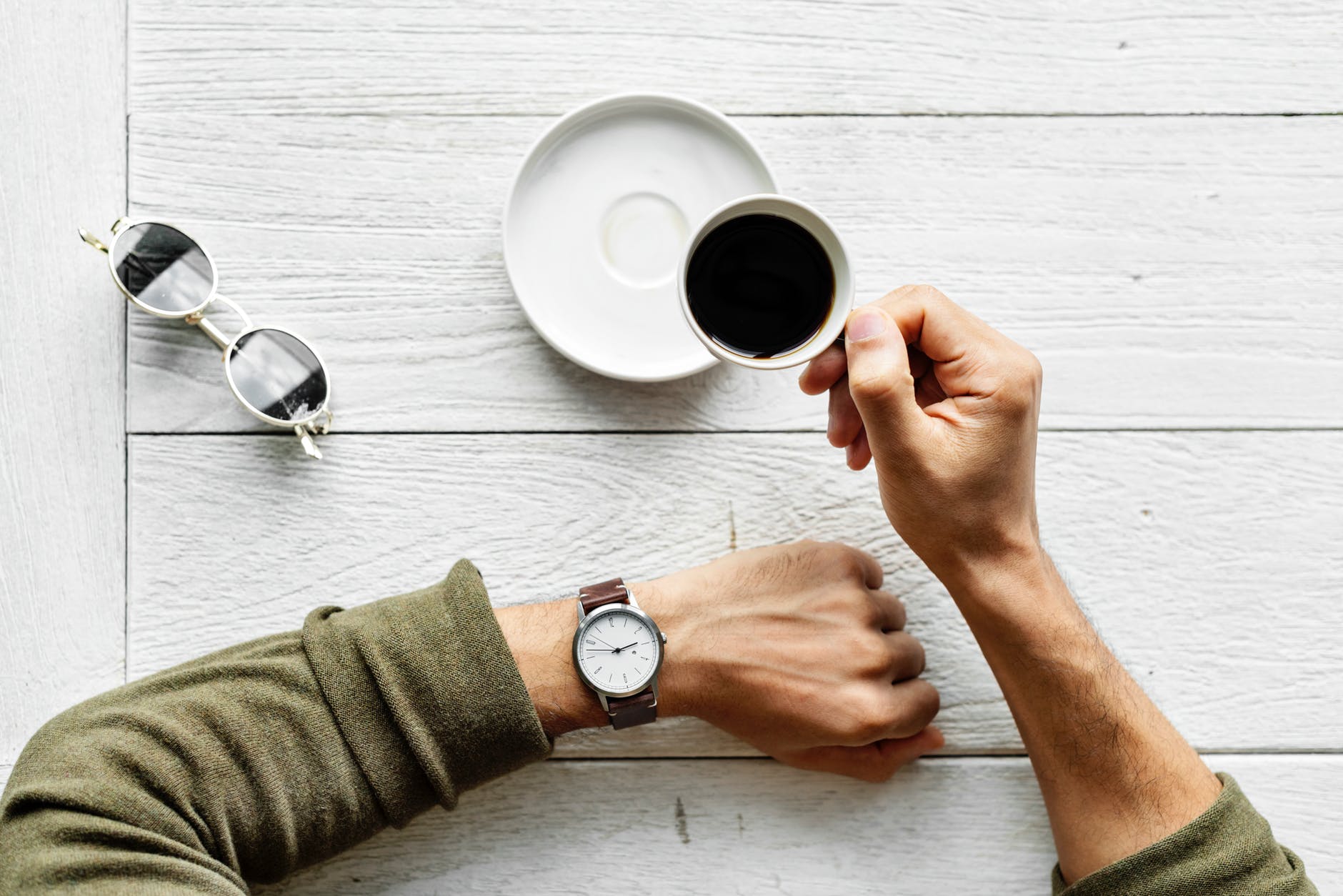 Man looking at his watch and thinking about financial marketing strategy