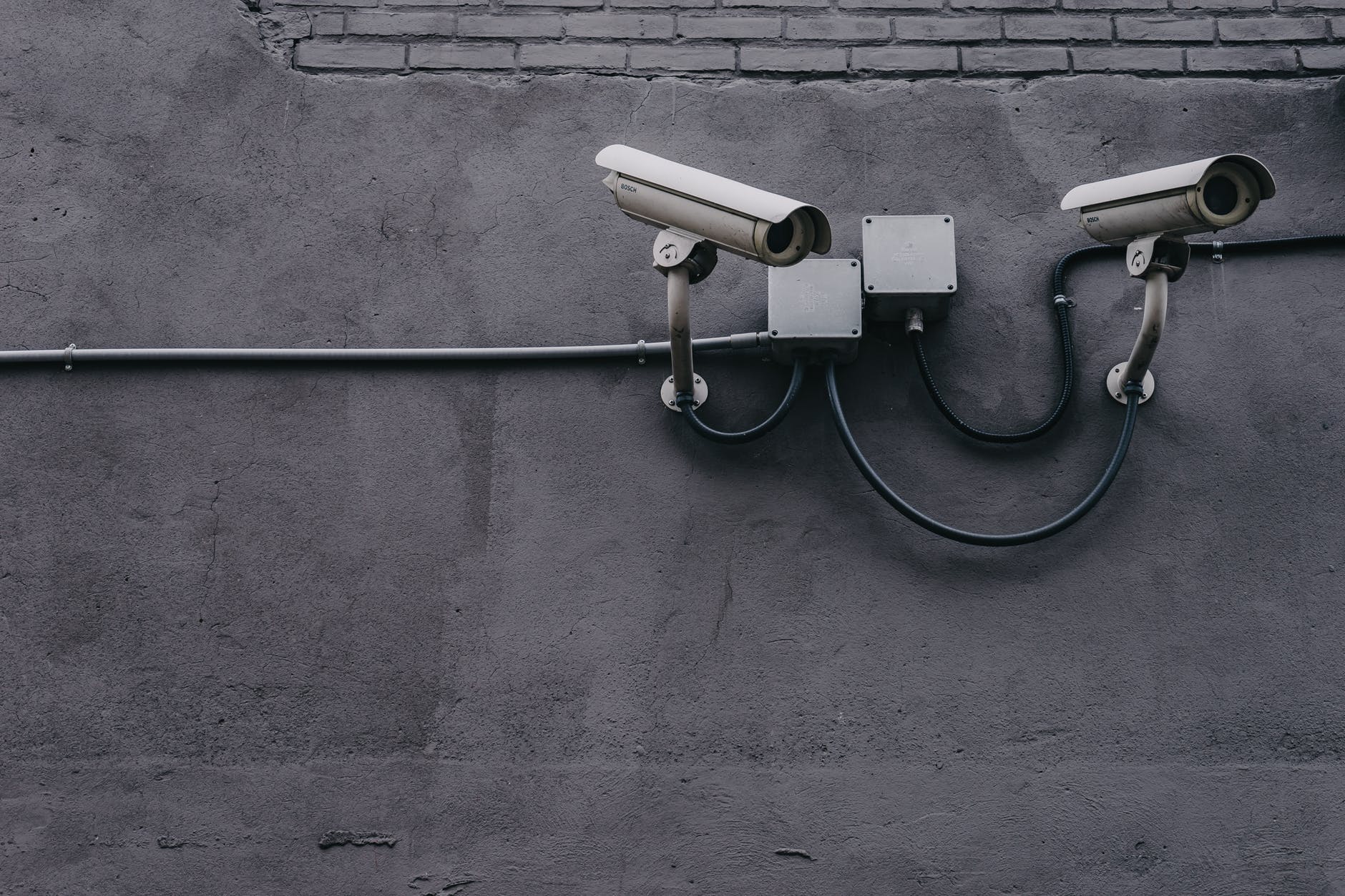 security cameras illustrating a hacker breach in marketing for financial services