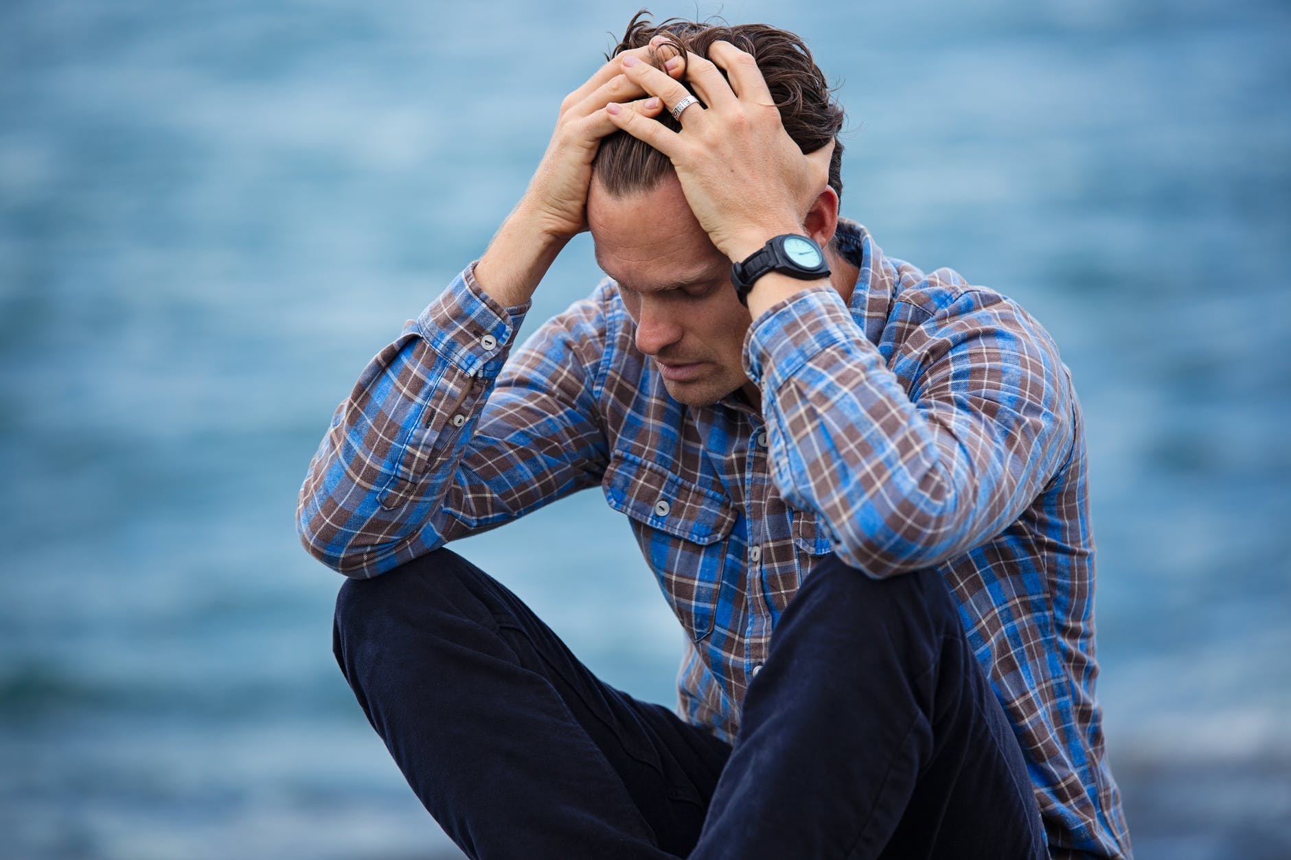 Man with writer's block in his financial marketing